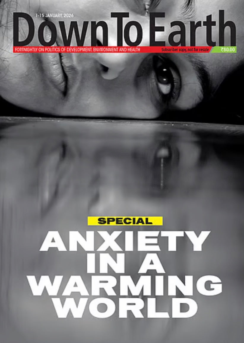 The cover of Down To Earth magazine displays a grayscale close-up of a person's face with a reflection, featuring the headline Special Anxiety in a Warming World.