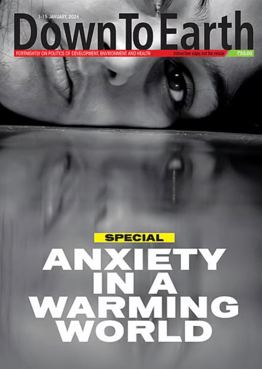 The cover of Down To Earth magazine displays a grayscale close-up of a person's face with a reflection, featuring the headline Special Anxiety in a Warming World.